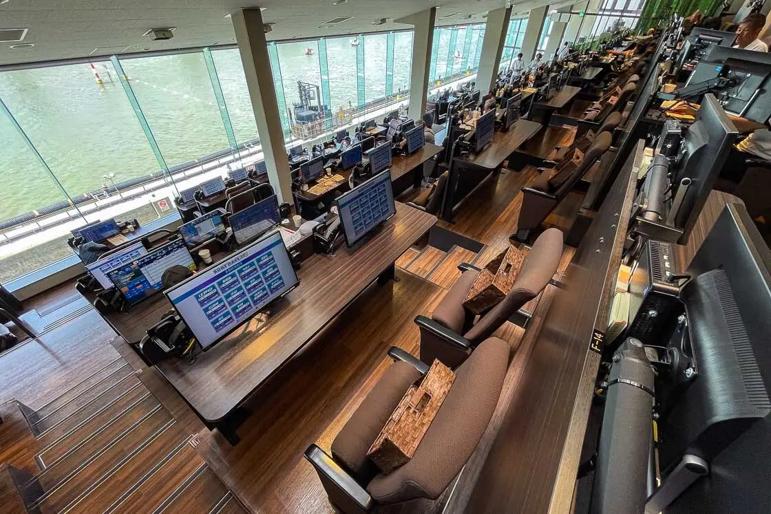 Paid, reserved seating with personal screens to look at all the boat races in the country as well as views of the course below. Picture taken at the Edogawa Boat Race stadium