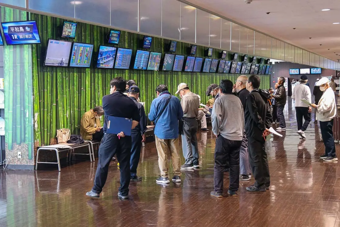 Watching another stadium's race on the monitors. Picture taken at the Edogawa Boat Race stadium